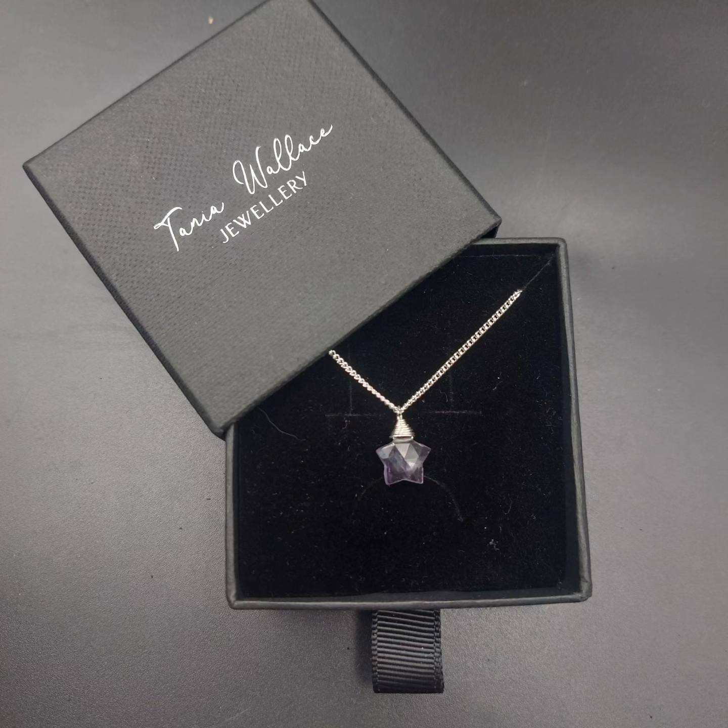 Faceted amethyst star pendant