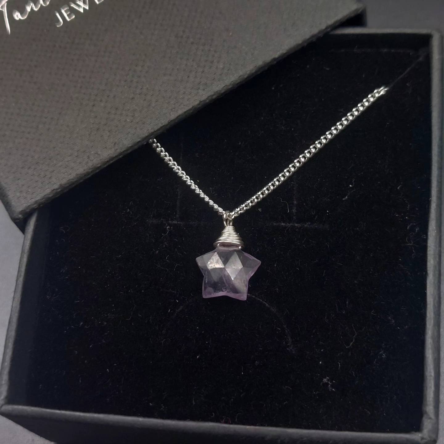 Faceted amethyst star pendant