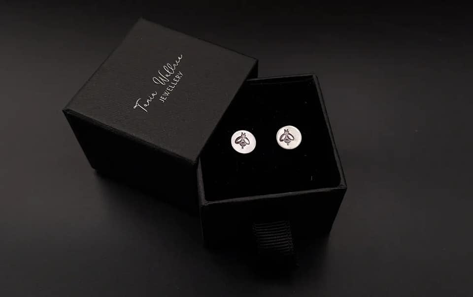 Silver studs with bee design