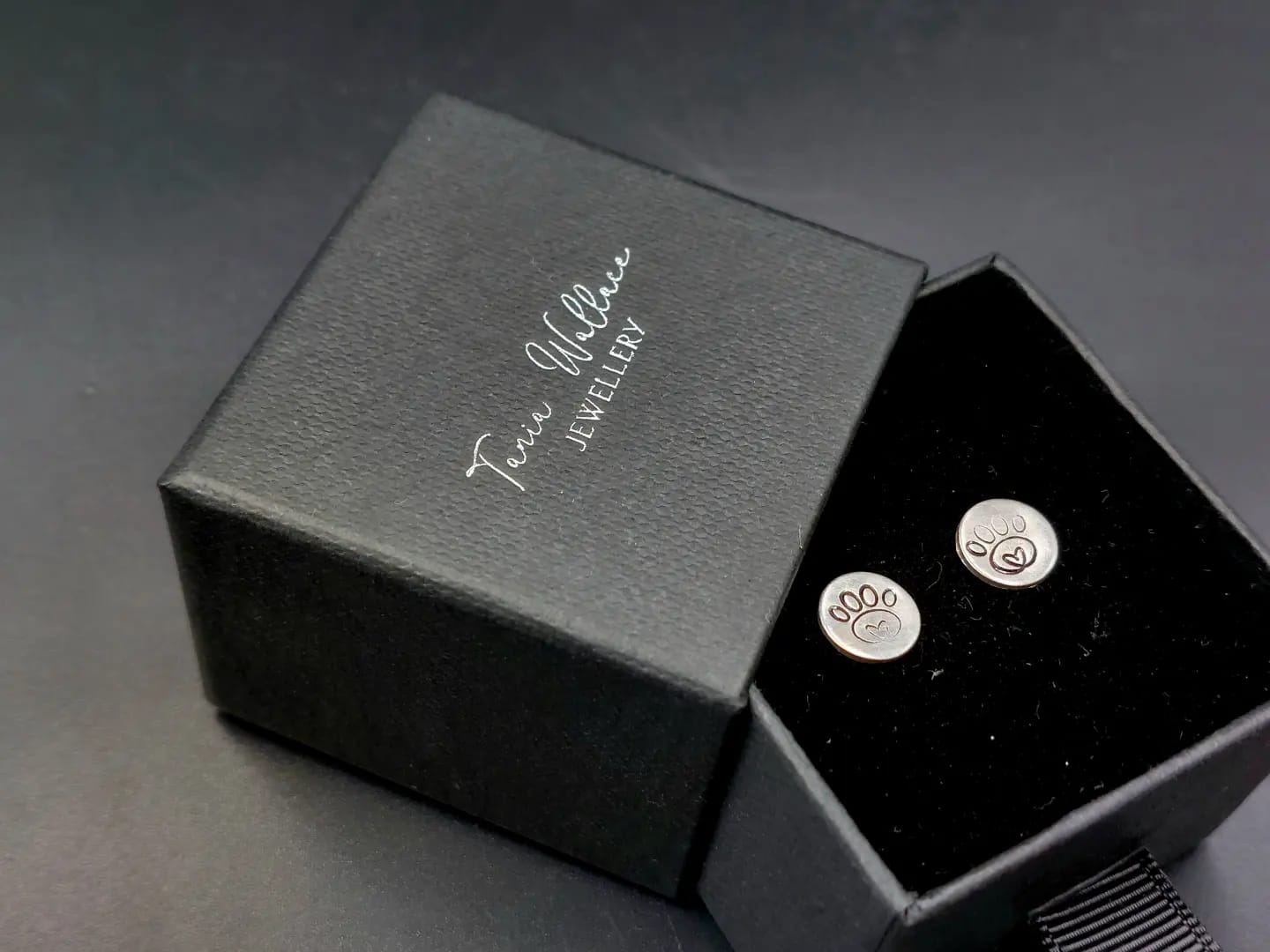 Silver studs with pawprint design