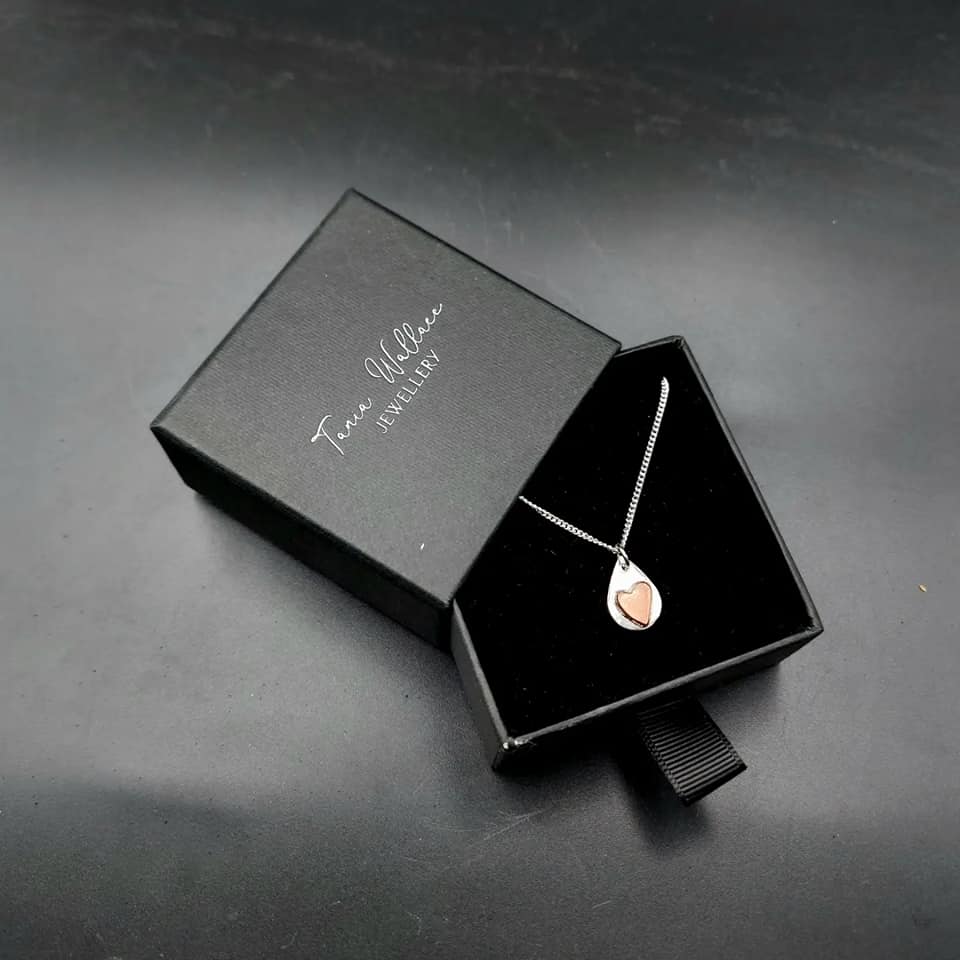 Silver teardrop pendant with copper heart