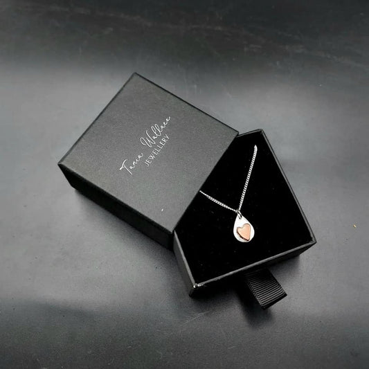 Silver teardrop pendant with copper heart