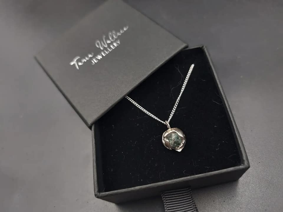 Raw emerald gemstone sand cast pendant