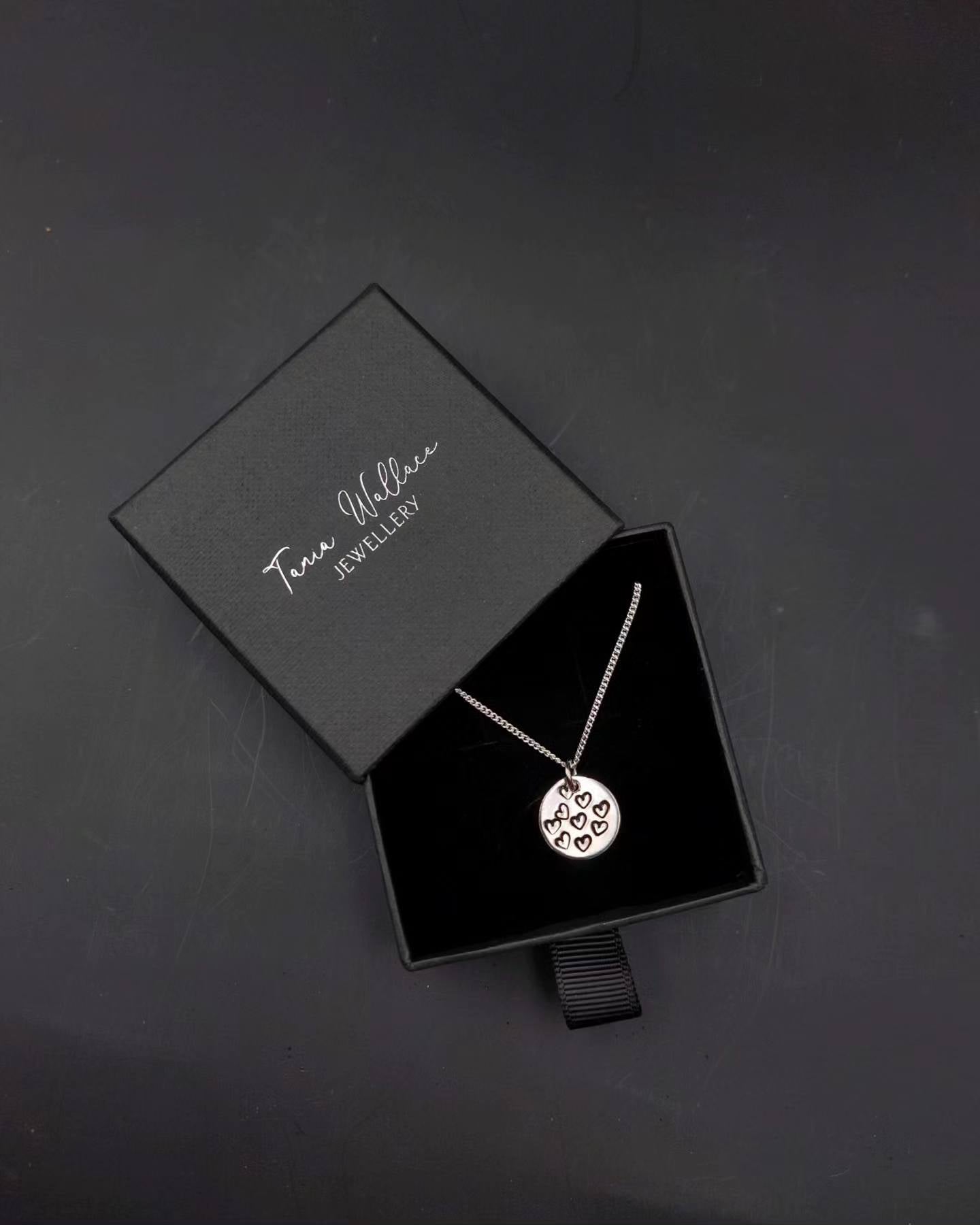 Round Pendant with Heart Patterns