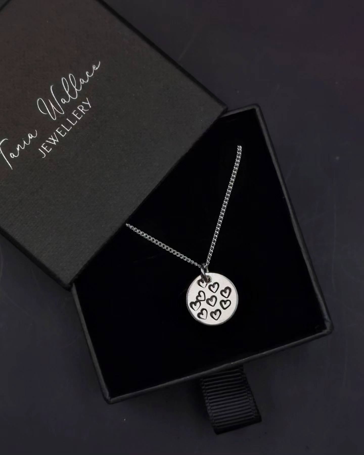 Round Pendant with Heart Patterns