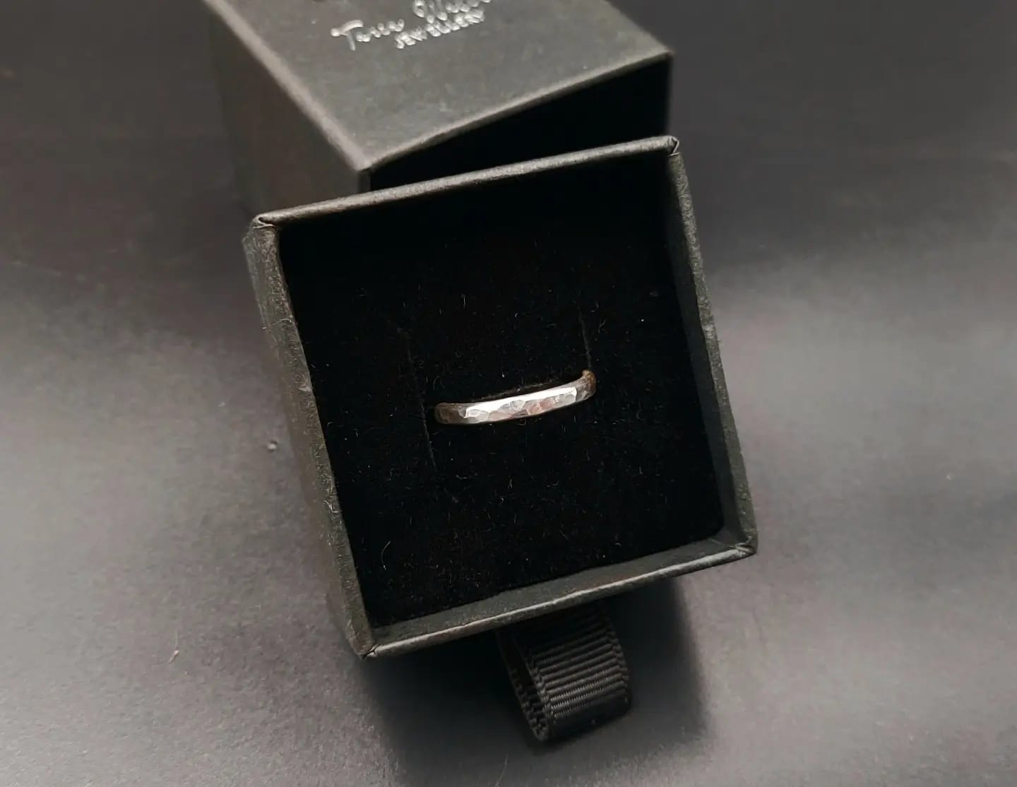 Silver band ring with hammered finish