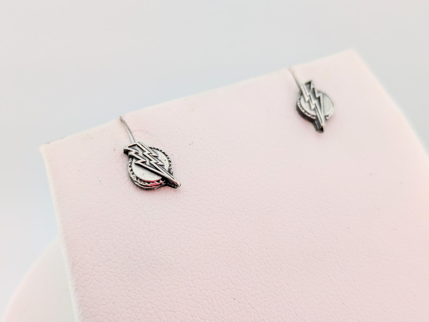 Lightning bolt earrings on white background