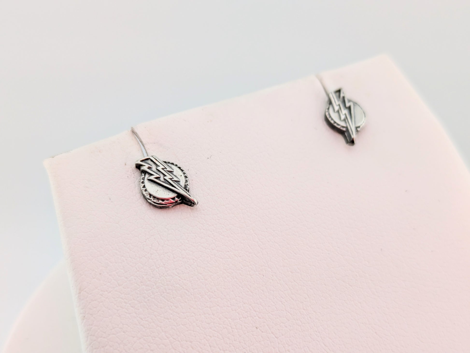 Lightning bolt earrings on white background