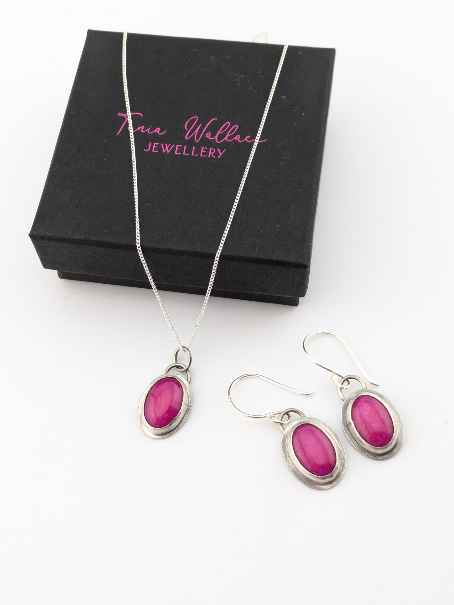pink jewellery set on white background
