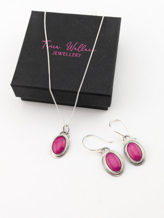 pink jewellery set on white background