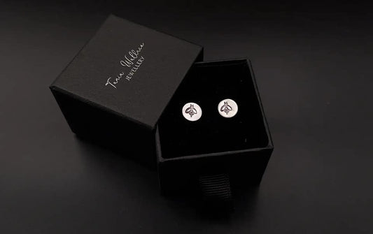 Silver studs with bee design