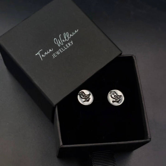 Silver studs with bird design