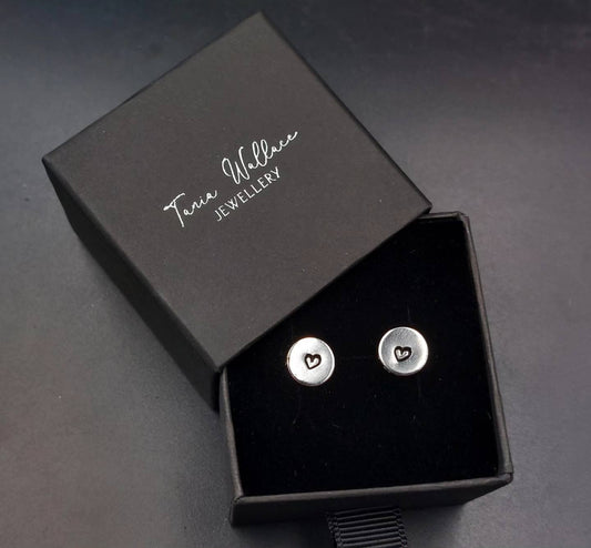 Silver studs with heart design