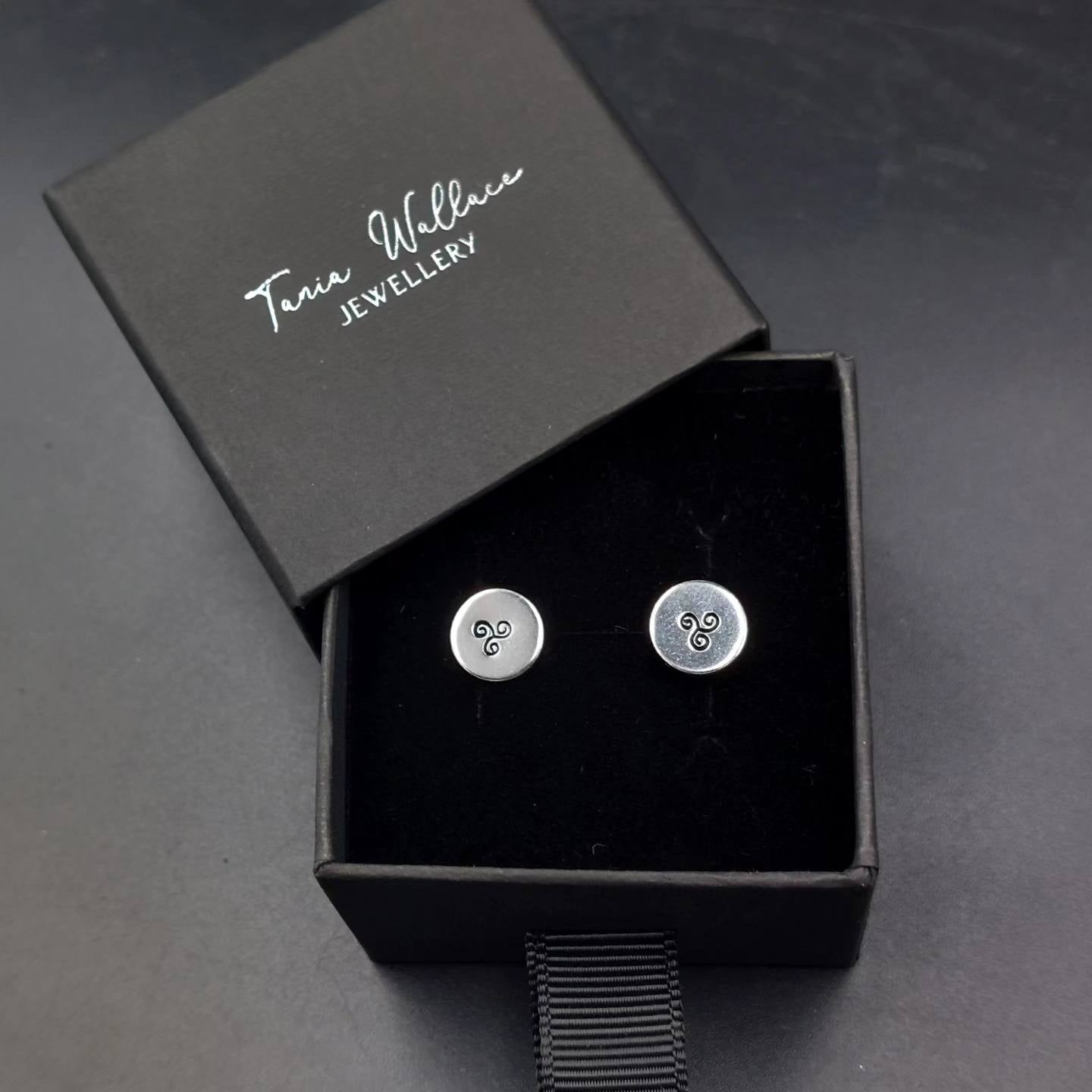Silver studs with spiral design