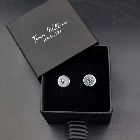 Silver studs with spiral design