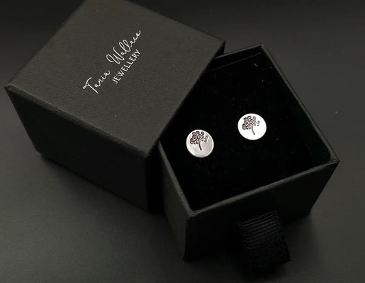 Silver studs with tree design