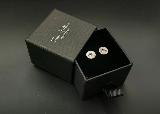 Silver studs with wave design